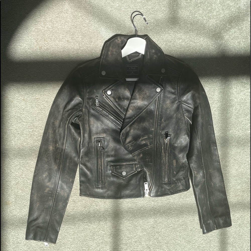 Leather moto jacket in classic length with zip-up front. NEW